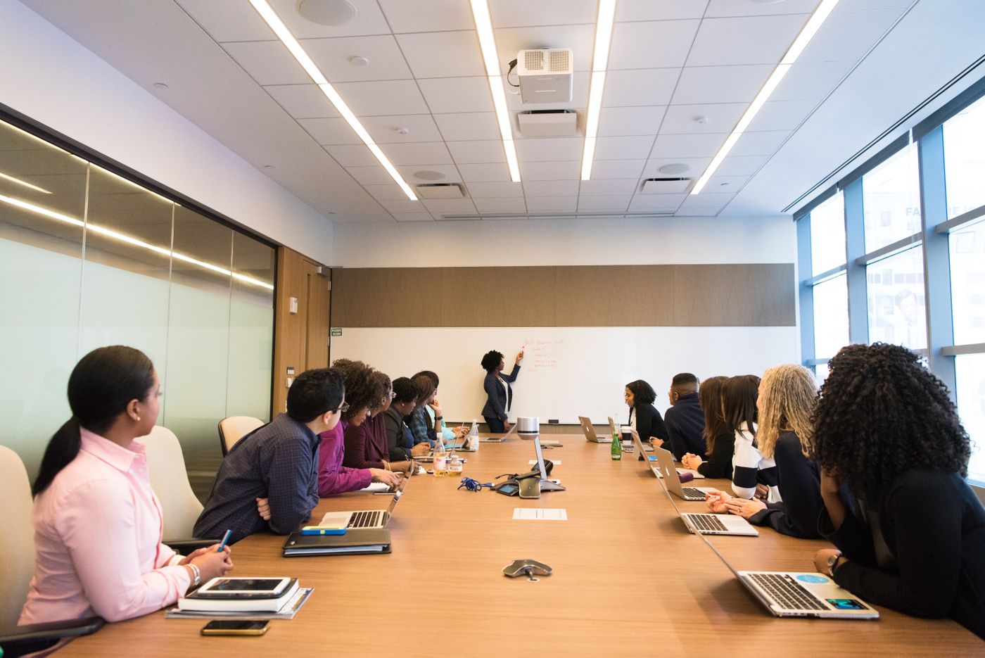 Leadership team working through a crisis communications plan in a boardroom