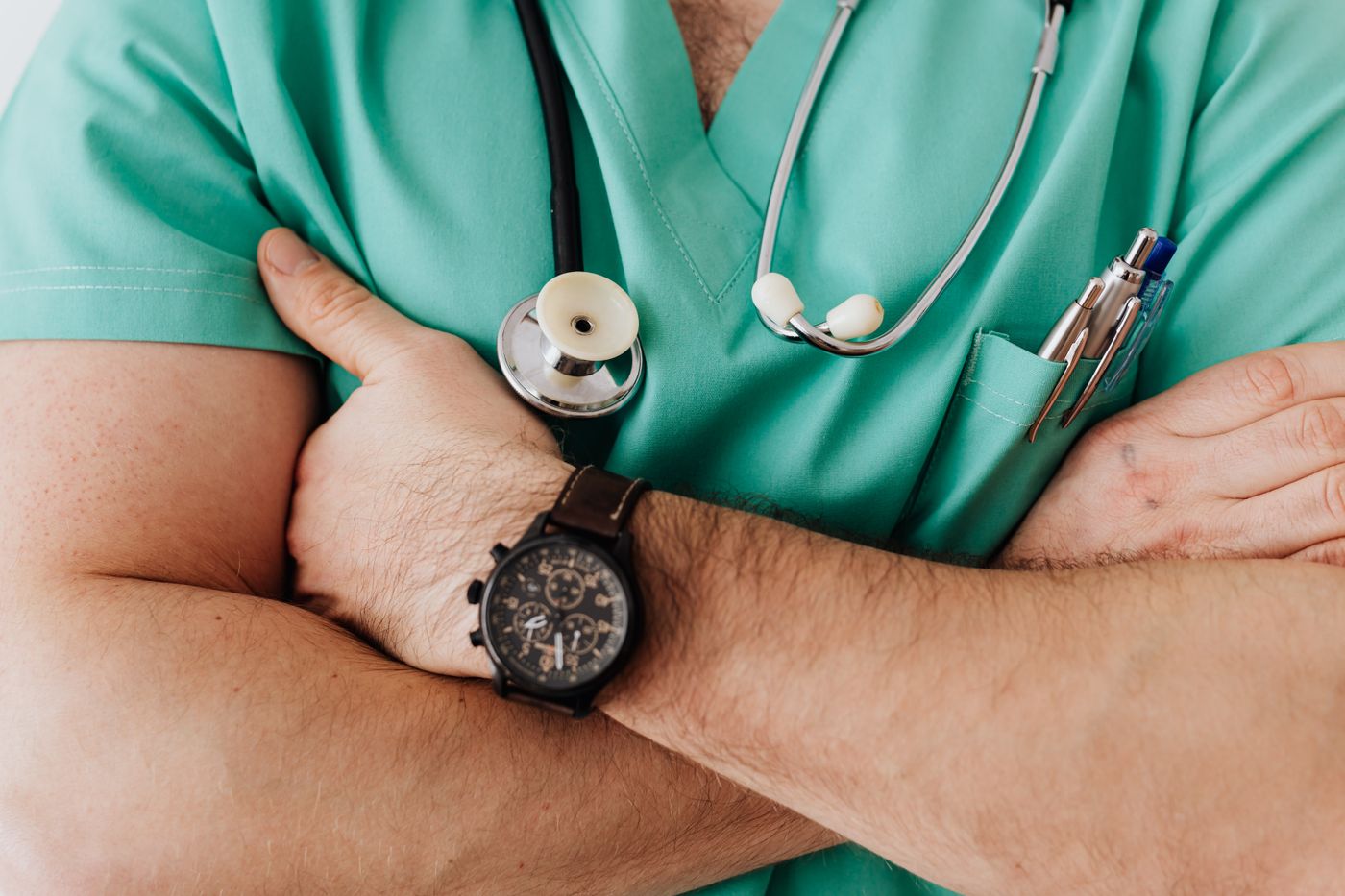 Healthcare clinician in scrubs, representing a medical leadership media programme