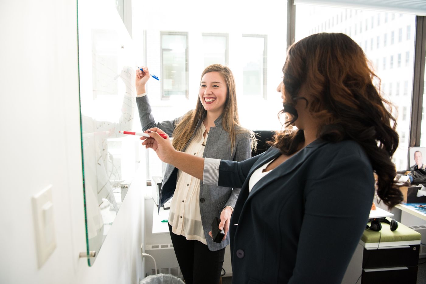 Spokesperson training session at a glass whiteboard