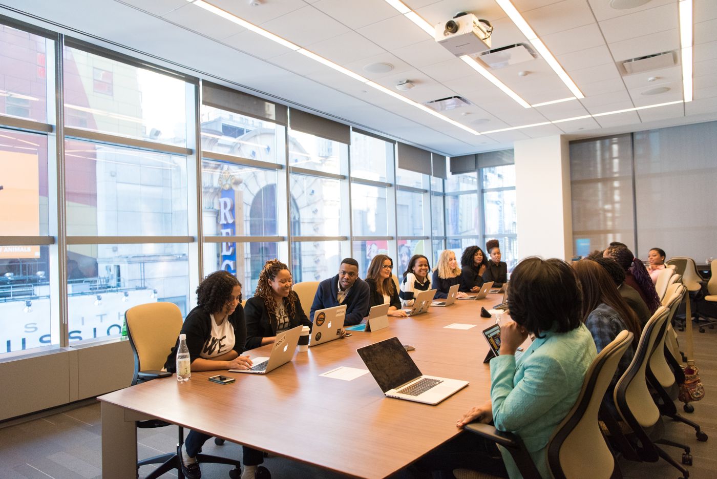 Communications team briefing journalists around a conference table